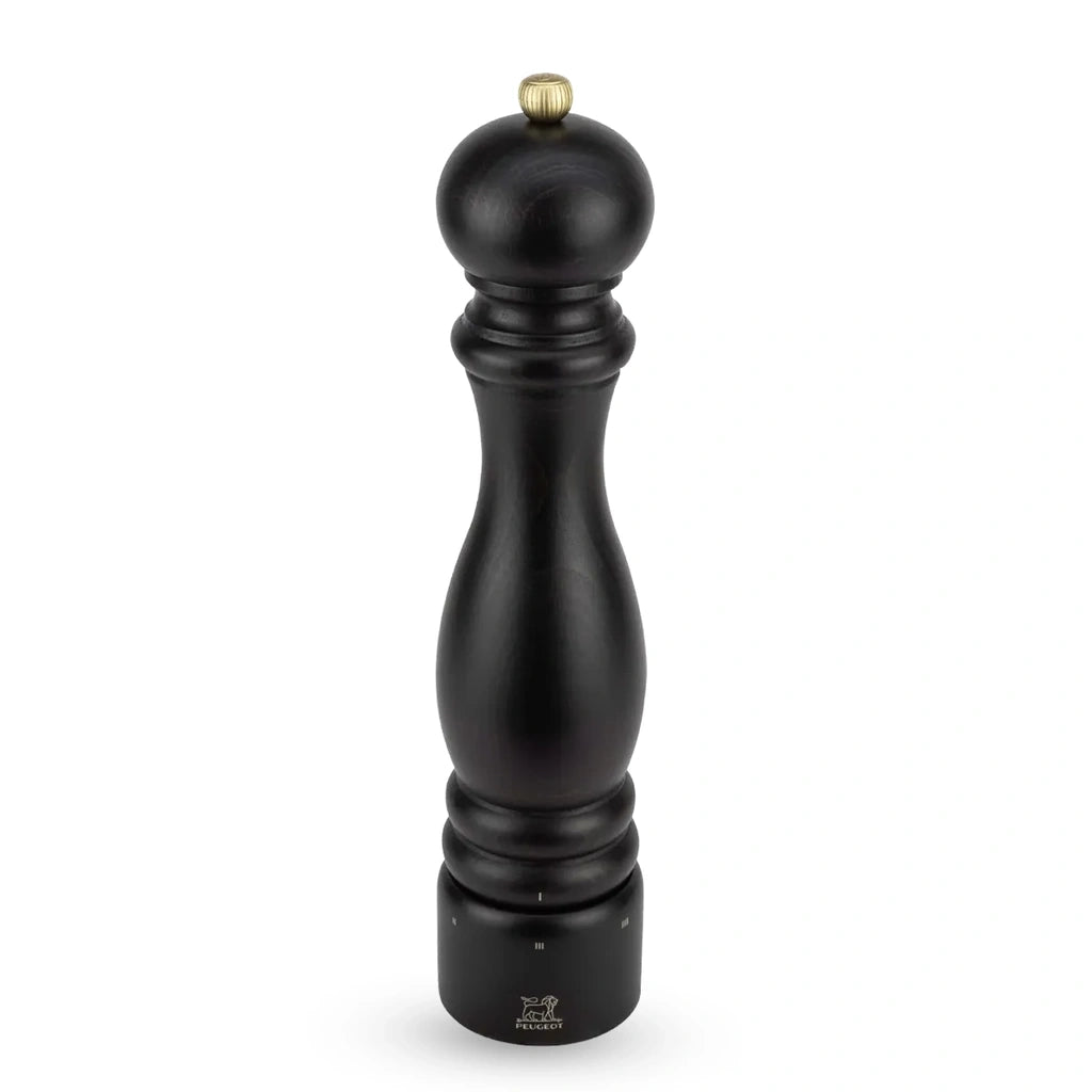 A tall black salt mill with a polished brass top knob and a silver-toned base dial, shown on a clean white background.