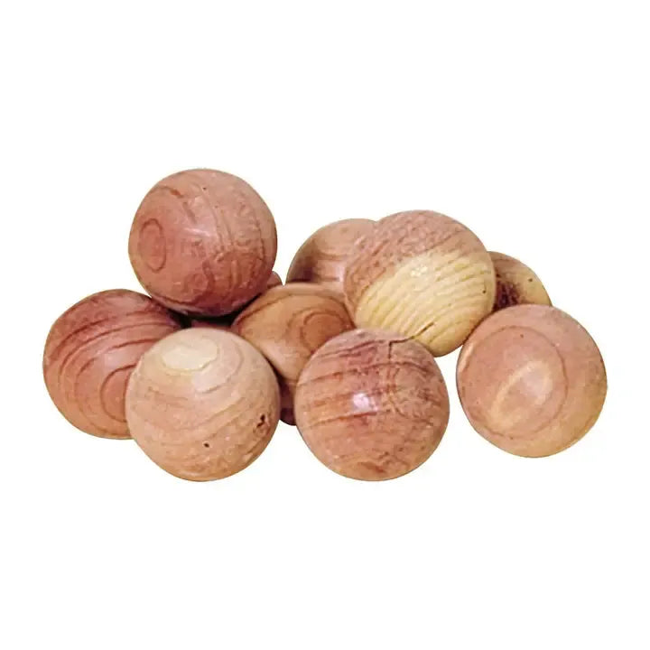 A pile of round wooden cedar balls with natural wood grain patterns in shades of brown and tan