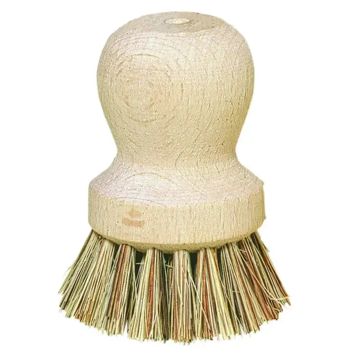 A natural wood-handled cleaning brush with dense tan and brown bristles, isolated on a white background.