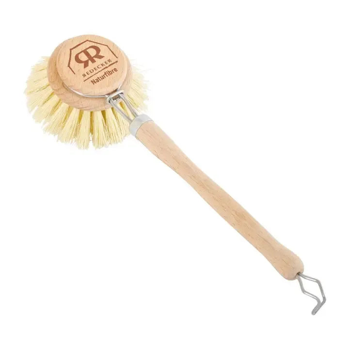 A natural wood-handled dishwashing brush with cream-coloured bristles, a circular wooden head printed with the Rainforest Natur fibre logo, and a metal hook at the end of the handle, shown on a plain white background.