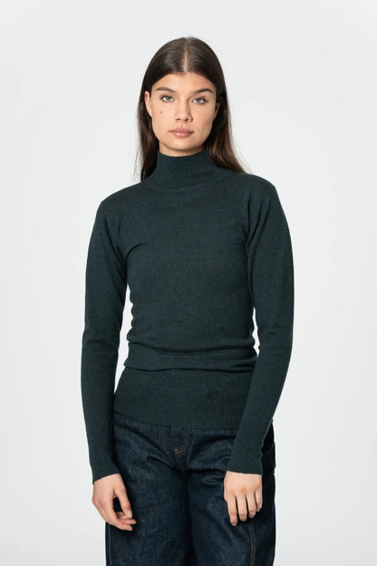 Dinadi women's merino turtleneck sweater in dark green, perfect for layering in cooler weather